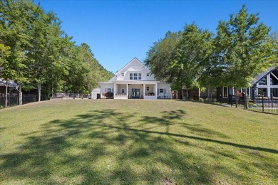 This coastal custom home is set on a protected bayou with serene - photo 37