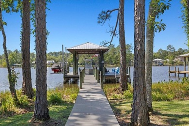 This coastal custom home is set on a protected bayou with serene - photo 42