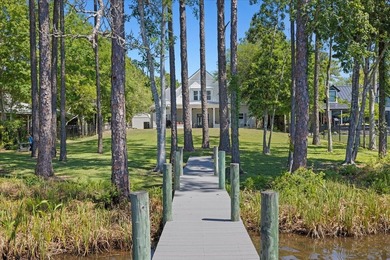 This coastal custom home is set on a protected bayou with serene - photo 50
