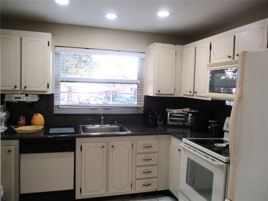 BEAUTIFUL, VERY SPACIOUS CORNER UNIT OFFERING ABUNDANT NATURAL