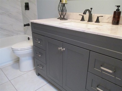 BEAUTIFUL, VERY SPACIOUS CORNER UNIT OFFERING ABUNDANT NATURAL