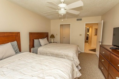 This stunning three-bedroom, two-bath, first floor villa, offers - photo 12