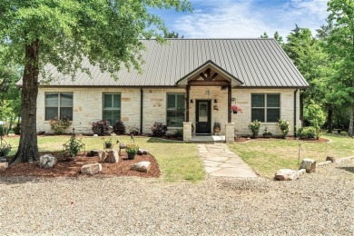 This waterfront home on Lake Fork is nestled away on almost 11 - Lake Home For Sale in Emory, Texas