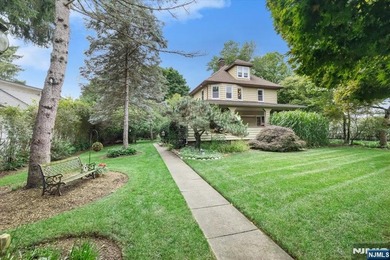 This home is gracefully positioned on a beautifully landscaped - photo 1