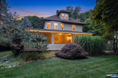 This home is gracefully positioned on a beautifully landscaped - photo 2
