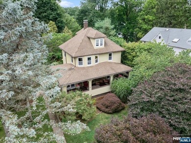 This home is gracefully positioned on a beautifully landscaped - photo 3