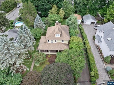 This home is gracefully positioned on a beautifully landscaped - photo 5