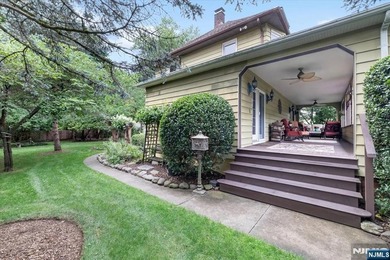 This home is gracefully positioned on a beautifully landscaped - photo 6