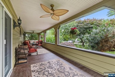 This home is gracefully positioned on a beautifully landscaped - photo 7
