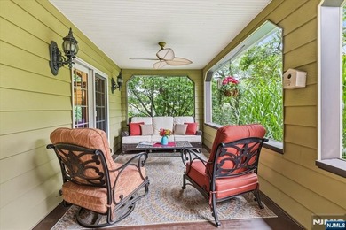 This home is gracefully positioned on a beautifully landscaped - photo 8