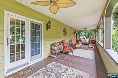 This home is gracefully positioned on a beautifully landscaped - photo 9