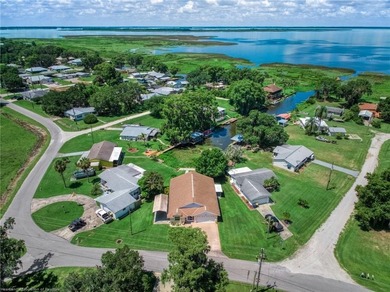Immaculate Waterfront Living with Direct Lake Access! Nestled on - photo 9