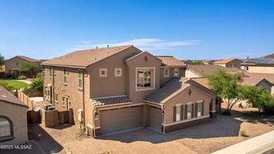 This gorgeous home is located the beautiful community of Saguaro