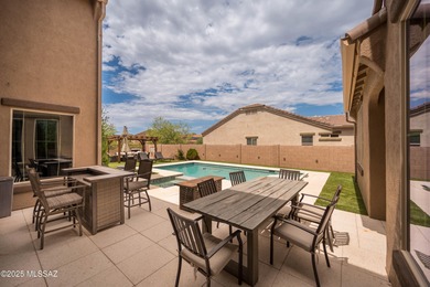 This gorgeous home is located the beautiful community of Saguaro