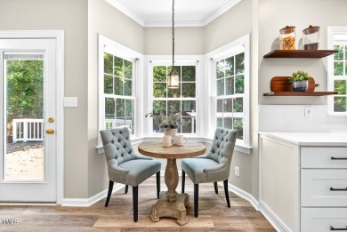 Tucked away on a tree-lined lot with fenced yard, this