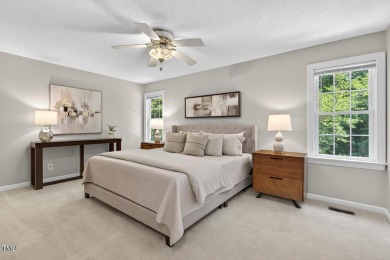 Tucked away on a tree-lined lot with fenced yard, this