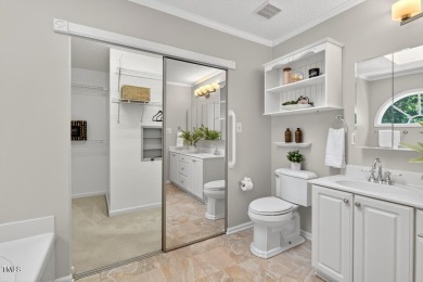 Tucked away on a tree-lined lot with fenced yard, this