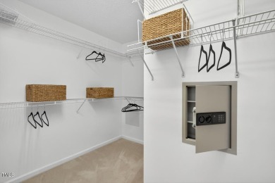 Tucked away on a tree-lined lot with fenced yard, this