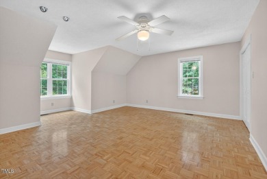 Tucked away on a tree-lined lot with fenced yard, this