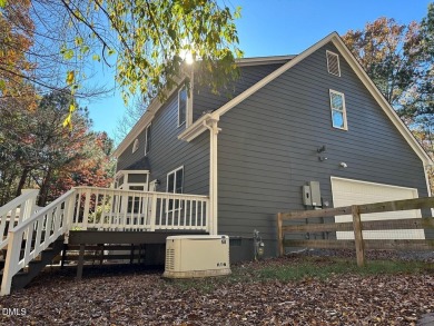 Tucked away on a tree-lined lot with fenced yard, this