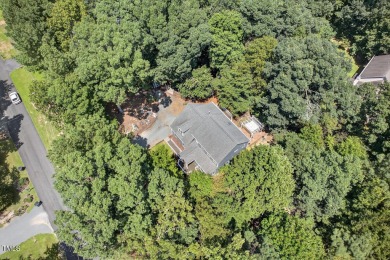 Tucked away on a tree-lined lot with fenced yard, this