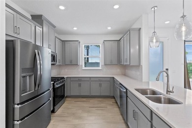 Set on a landscaped cul-de-sac lot with water views, this nearly - photo 8