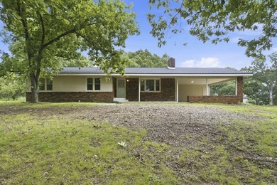 Just minutes from Stockton Lake, this move-in ready home sits on - photo 1