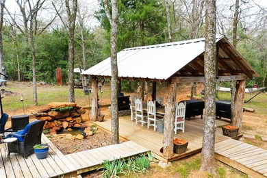 Experience true serenity on a heavily wooded 10.16 acres made - photo 33