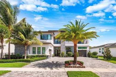 Located in the prestigious Boca Bridges community, this stunning - photo 1