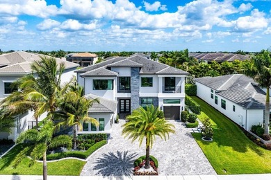Located in the prestigious Boca Bridges community, this stunning - photo 2
