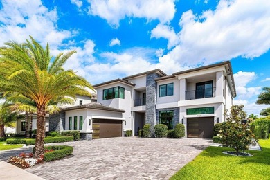 Located in the prestigious Boca Bridges community, this stunning - photo 3
