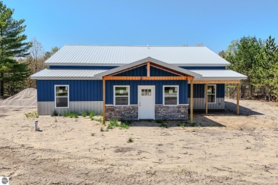 Lake Home For Sale in Rapid City, Michigan