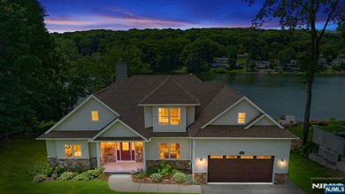 Prepare to experience lakefront living at its absolute best! Set - photo 1