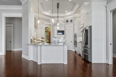 Experience exceptional waterfront living in this custom-built - photo 10