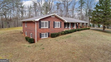 Lake Home For Sale in Flowery Branch, Georgia