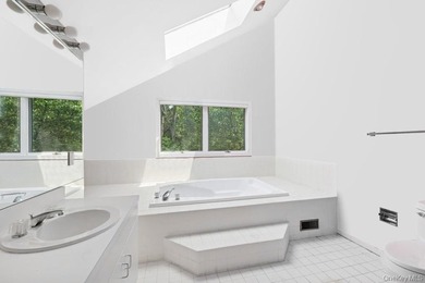 Tucked away on 1.4 acres of lush, landscaped grounds, this - photo 12