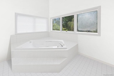 Tucked away on 1.4 acres of lush, landscaped grounds, this - photo 13