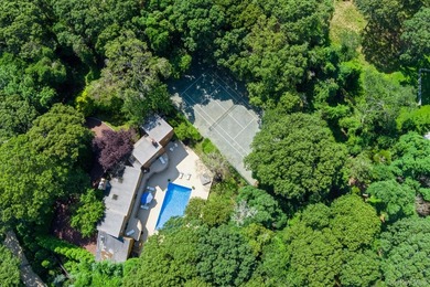 Tucked away on 1.4 acres of lush, landscaped grounds, this - photo 25