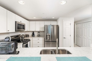 Experience coastal luxury at its finest in this rare first-floor - photo 8