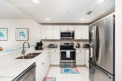 Experience coastal luxury at its finest in this rare first-floor - photo 9