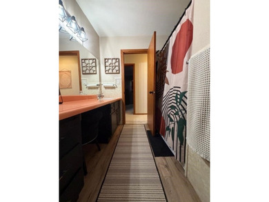 This home features a 2-car attached garage and a thoughtfully - photo 17