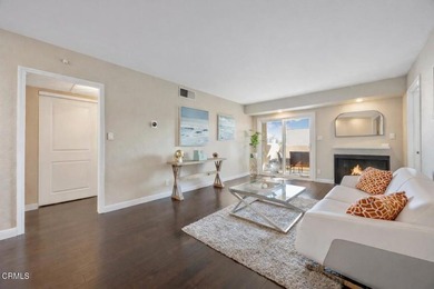 Welcome home to this 1-story top floor end unit that has been