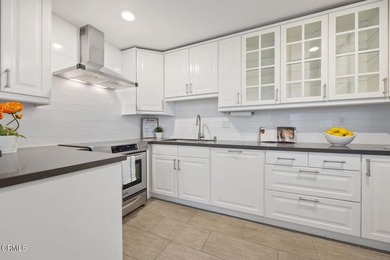 Welcome home to this 1-story top floor end unit that has been