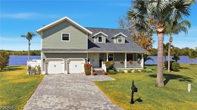 Welcome home to this furnished elevated home only steps from the - photo 1