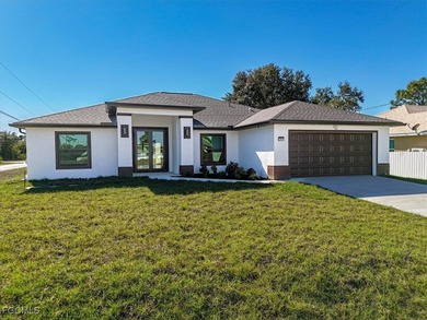 Lake Home For Sale in Lehigh Acres, Florida
