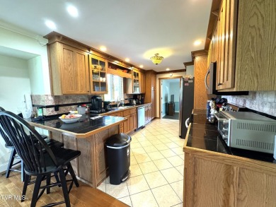 Nice, completely remodeled brick ranch with 3 master suites (one