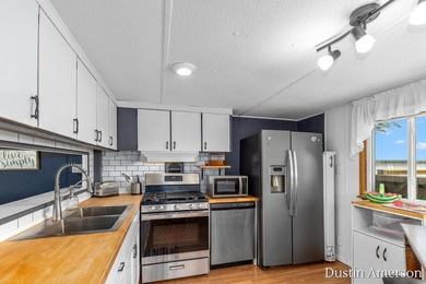 Enjoy waterfront living on 400-acre, all-sports Thornapple Lake! - photo 5