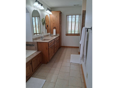 Nestled into a quiet cove, this 1 1/2 story home offers 3 - photo 12