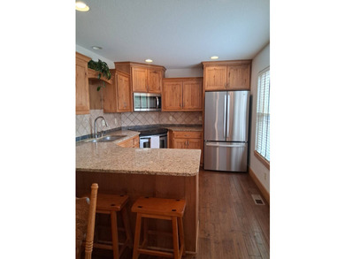 Nestled into a quiet cove, this 1 1/2 story home offers 3 - photo 15