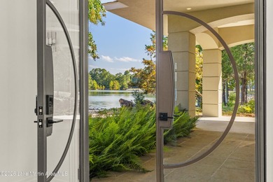 This 5BR Trillium estate redefines lake living. Over 850 ft of - photo 7
